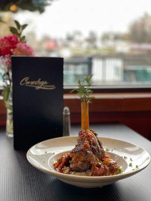 Roasted Lamb Osso Buco: Lamb shank with fresh garden vegetables braised in Greek red wine, served over rice.