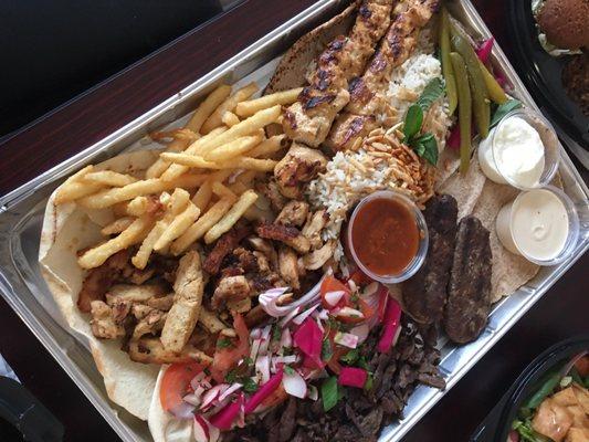 Combo Dinner 2 to 4 People
 Chicken & Beef Shawarma, Gyro, Md. Hummus, Md. Baba Ganoush, Large Fatoush Salad, Yalow Rice Pita Bread & Sauce