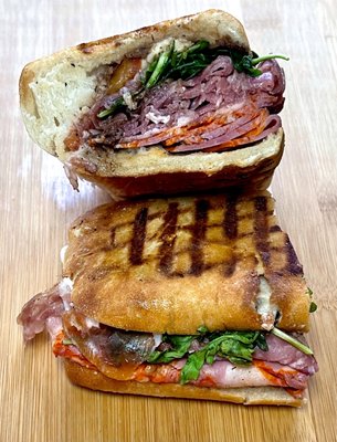 Daniele - panini - Prosciutto, Sopresatta, cappicollo, fresh mozzarella, Arugula, vine ripe tomatoes, evoo, Balsamic, w/ pickle & chips