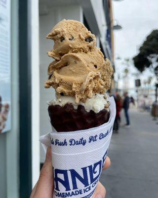 Dipped waffle cone with graham central station on too and Oreo beneath