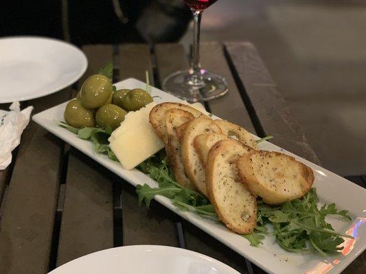 Bread, olives and cheese over arugula!