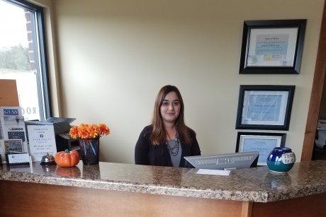 Shawna greets patients at the front desk.