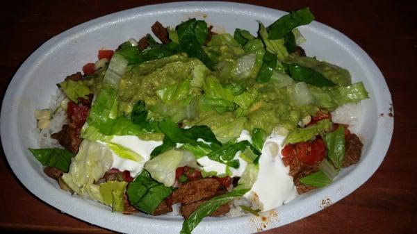 Steak bowl with white rice, black beans, mild salsa, corn, lettuce, salsa and guacamole. DELICIOSO!