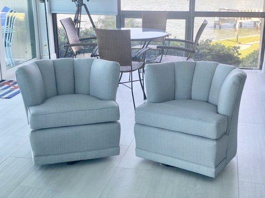 Set of winged back swivel chairs.