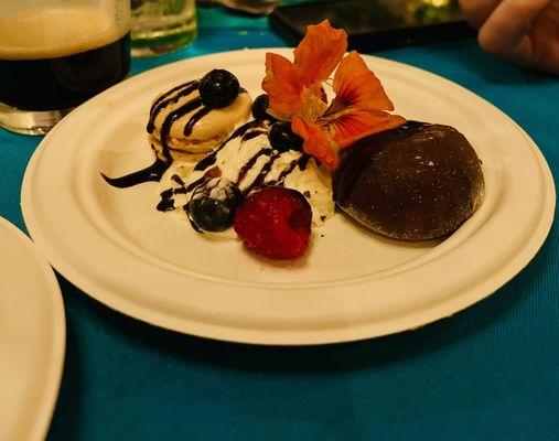 Dessert of the night - Mochi icecream, macaron, edible flowers, fruits, whipped cream, dark chocolate ganache syrup