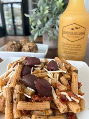 Come try our Red Lentil Pasta Salad. GLUTEN FREE and VEGAN. Penne pasta, Kalamata olives, sun-dried tomatoes, with pesto and vegan cheese!