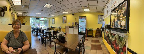 Pano of my wife and the restaurant. Just ordered and waiting for our meal.  $40 with one appetizer and two Pho entrees.