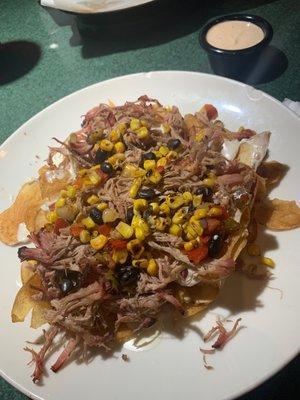 Red Neck Nachos!! OMGoodness sooo sooo delicious! Crispy potato chips, savory pulled pork, black beans and grilled corn.