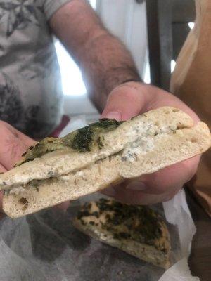 Spinach and chive bagel with garlic herb cream cheese