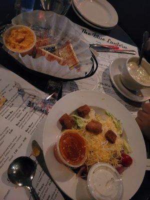 Salad, soup and crackers with cheese spread that come with every entrée