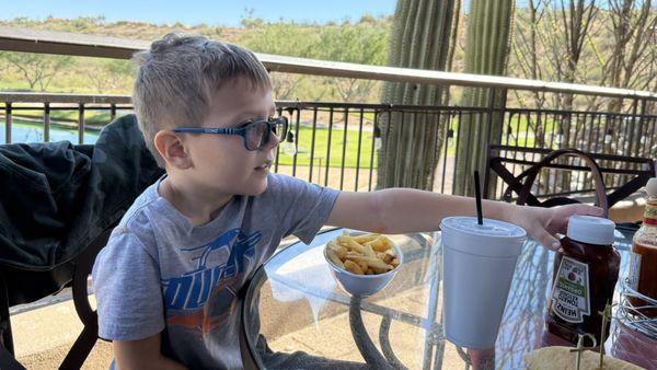 Five-year-old enjoying his french fries