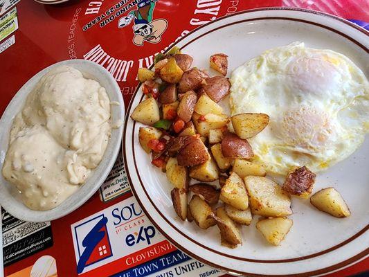 2 eggs over easy with potatoes and biscuits & gravy