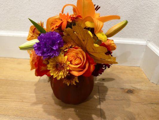 Fall themed arrangement with a pumpkin vase (hard to see)