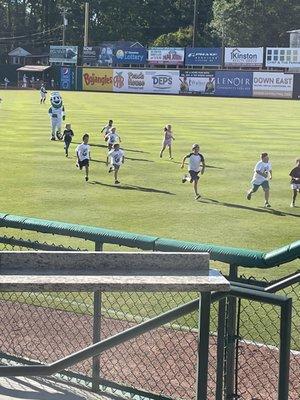 Mascot running with kids