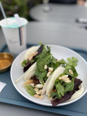 Steamed Buns with pork, wontons, peanuts, jalapeños and spring mix.