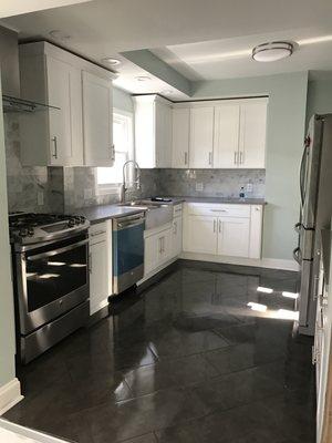 Total kitchen remodel. (cabinets , backsplash, appliances, window, drywall and lighting)