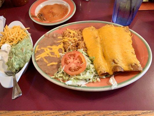 Number 6: 3 beef enchiladas with melted cheese, refried beans, Spanish rice, lettuce and tomato.