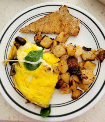 Omelet w spinach, mushrooms, mozzarella cheese & bacon & an omelet w bacon & cheddar cheese.