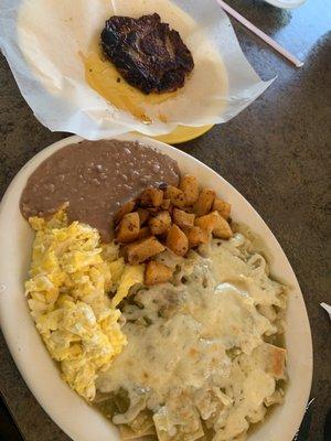 Chilaquiles verdes w/ scrambled eggs, papas, and beans. And chuletas a la carte.