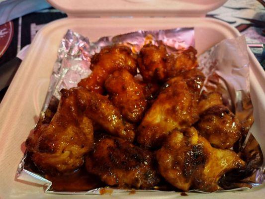 The hot wings were breaded and appeared to be baked as they had burn marks on them.