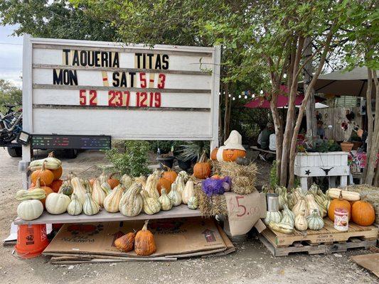 Sign out front with some seasonal (Thanksgiving) produce