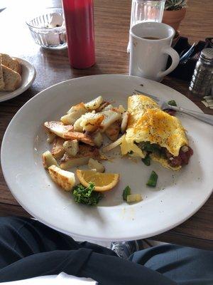 Meat lovers with onions and peppers. Homefries and rye toast.