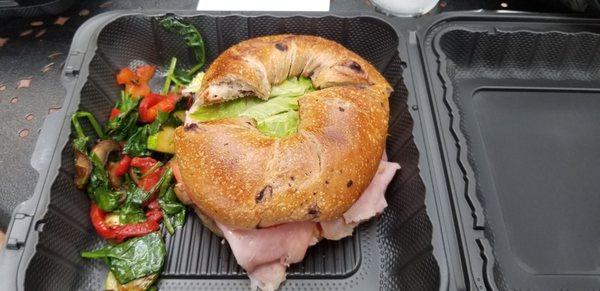 Ham & swiss on a blueberry bagel with veggies