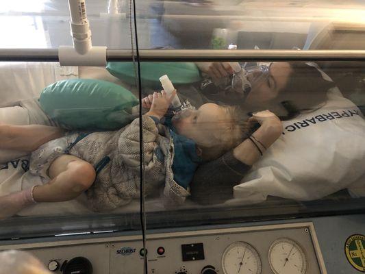 1-year-old in the hyperbaric chamber with mom.