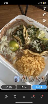 3lengua tacos fully dressed with beans and rice with 3 limes 2 salsas