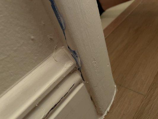 Installed baseboard over painters tape