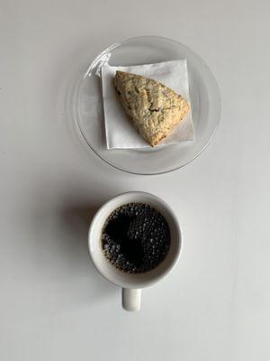 Drip coffee and a cocoa-nut scone.