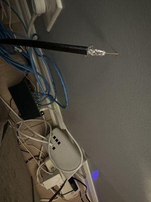 The NEWLY RUN frayed trunk cable that fell out of its connection to the cable modem 4 days after installation.