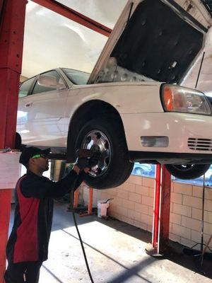 A very nice Cadillac getting new shoes! And taking full advantage of our THREE free standard lube oil & filters!