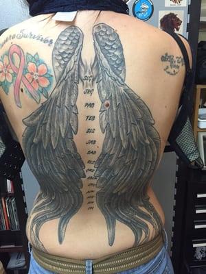 A healed set of black and grey wings from earlier this year.  I DID NOT do the tattoos on the shoulders.