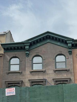 Cornice is Fully repared and painted. Complete brownstone renovation.