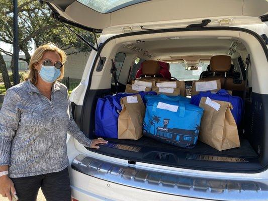 A volunteer loads up her car for our Kosher Home Delivered Meals program for homebound Older Adults