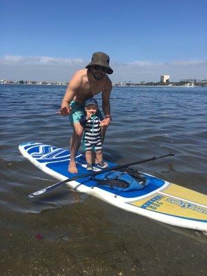 Baby's first time standing on paddle board!