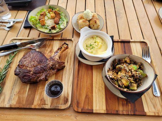 Bone-in Prime Rib, Ceasar Salad, Rolls, Mashed Potatoes, and Brussel Spouts. We both shared this meal.