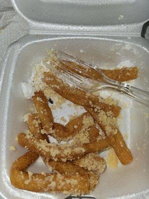 Funnel fries with a fly as garnishment