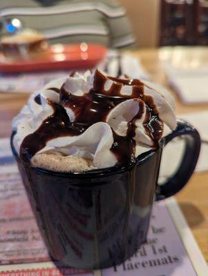 Cafe Mocha with whipped cream and chocolate syrup.