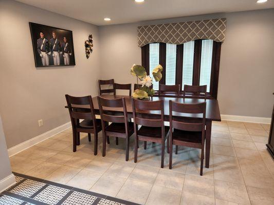 Extendable table with ladder backed chairs. Holds up to 12 leaves.