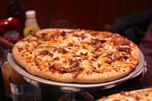 Large Southwestern BBQ Pizza ($40.50) - BBQ sauce, blended mozzarella, chicken, bacon, onions, cheddar cheese