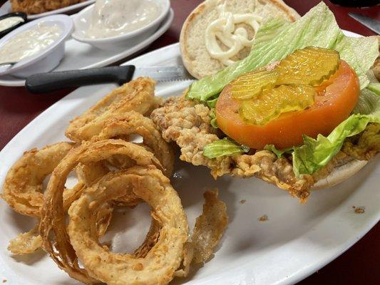 Hand breaded steak sandwich and onion rings