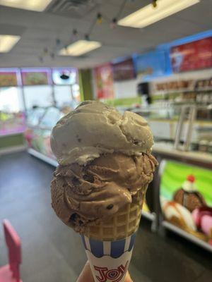 Pecan and chocolate ice cream cone.