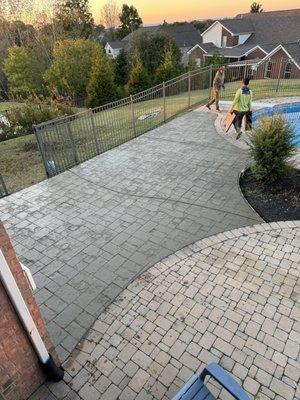 Stamped concrete , their existing pavers are in bad shape so concrete it was !