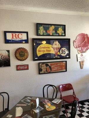 Different memorabilia on the soda shop wall.