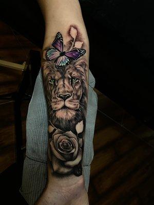 Lion, butterfly, rose tattoo