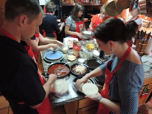 Making red chile beef enchiladas.