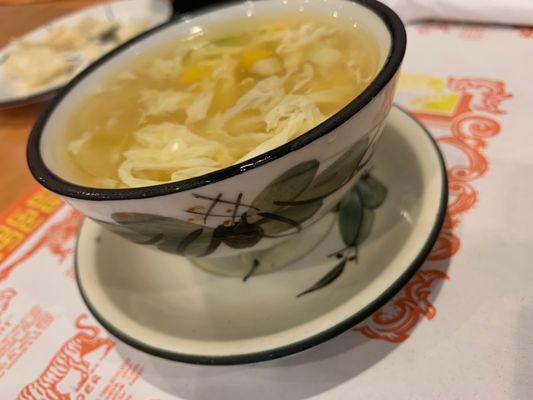 Egg drop soup in a pretty cup.