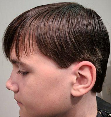 Clipper over comb trim on the sides with scissors on top